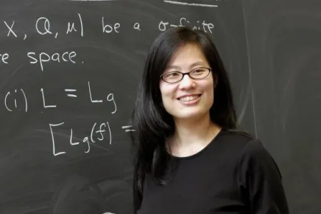 Leslie Cheng teaching at the chalkboard