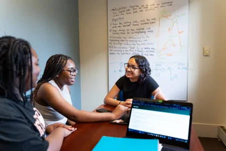 Three students in Quantitative Center