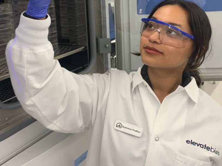 Pradhan doing internship research in a lab