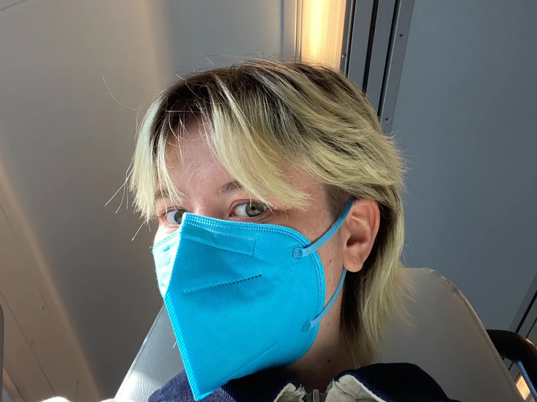 Headshot of Orli McGuire-Berk wearing a blue mask