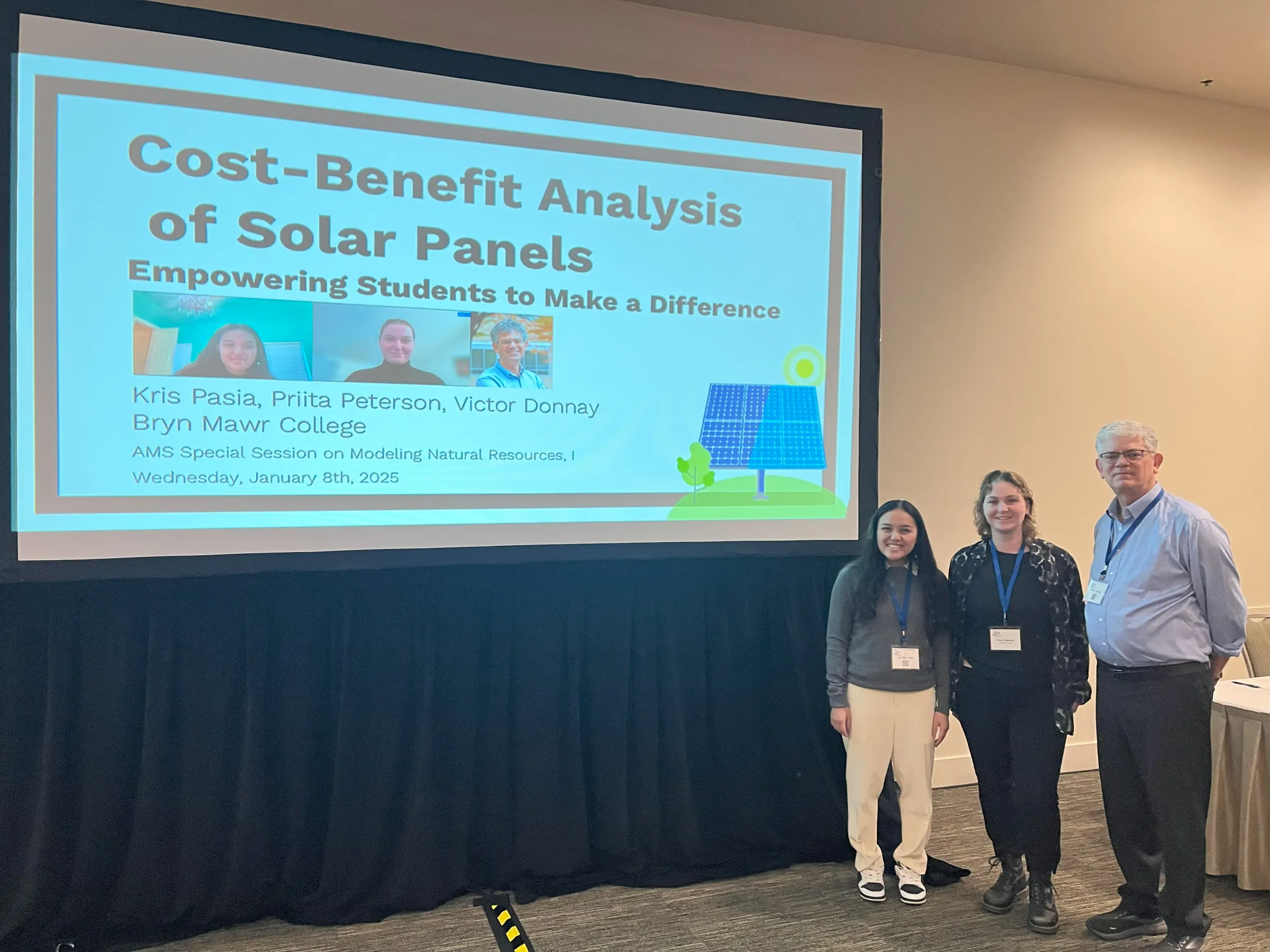 Math students and Victor Donnay in front of presentation titled "Cost-Benefit Analysis of Solar Panels: Empowering Students to Make a Difference"