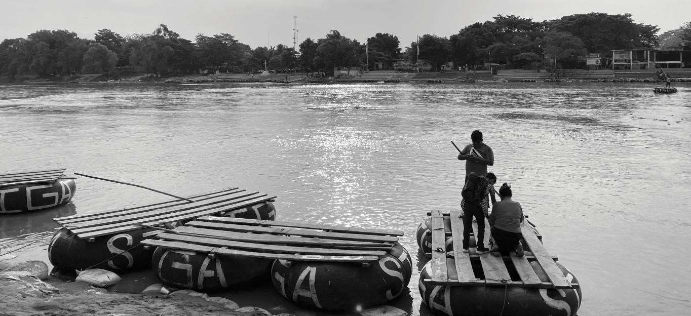 Image of migrants crossing river