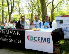 Students, including Andy Clark, sitting at a GSAS table for an event