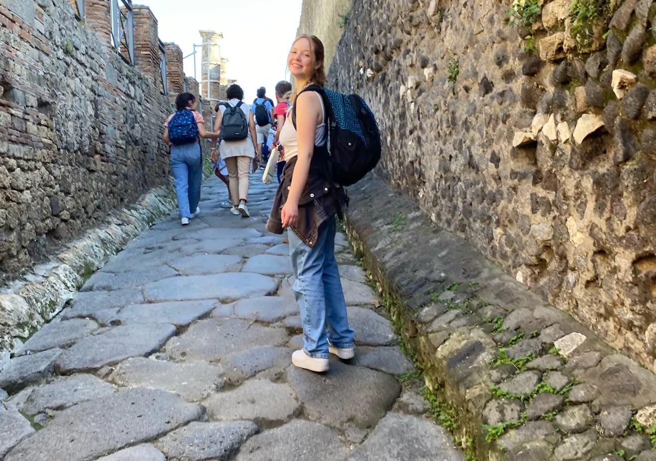 Quinn Christensen standing in a street way in Florence, Italy 