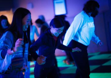 students happily roller skate in the campus center