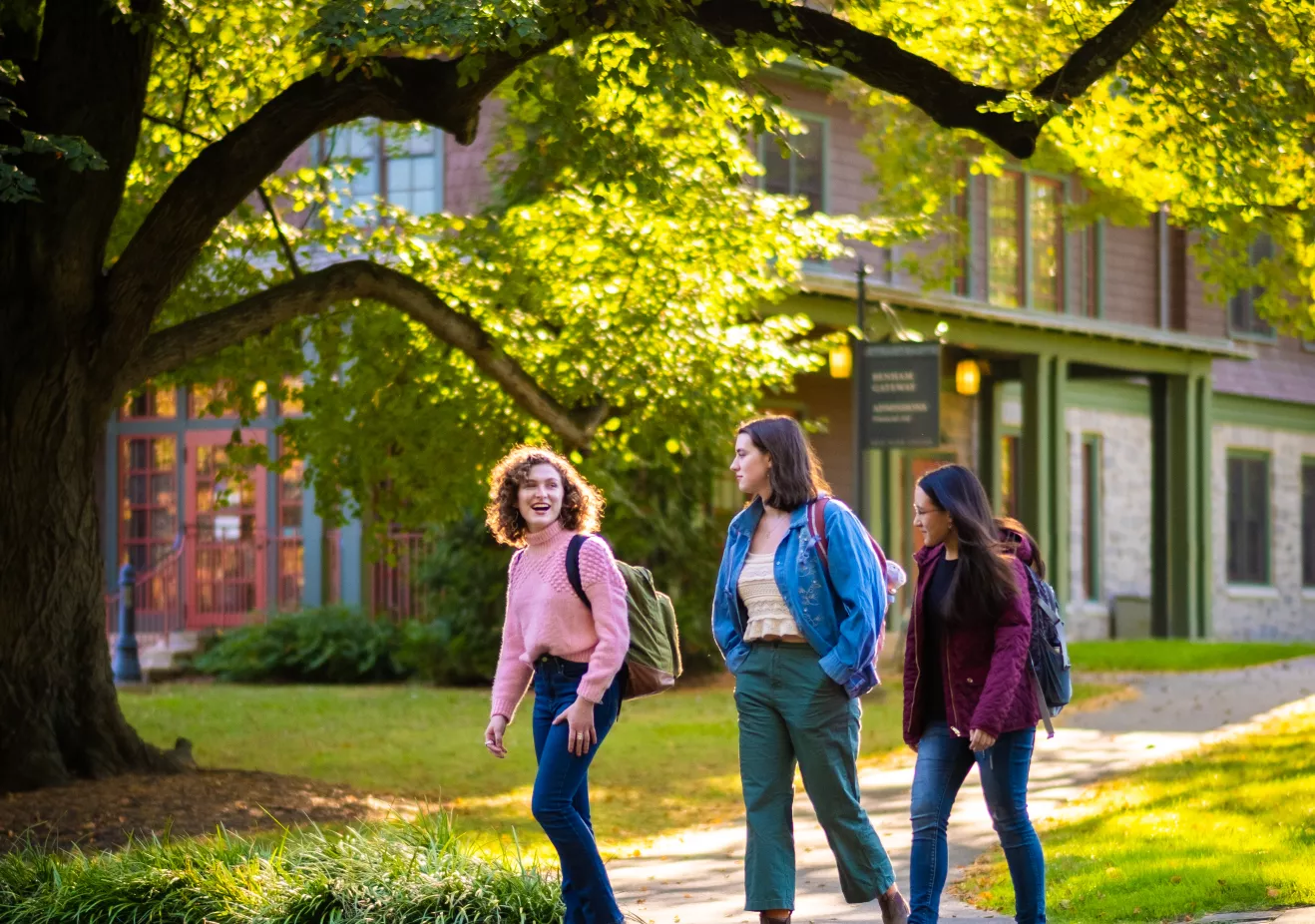 Three students walking in front of Benham Gateway Admissions