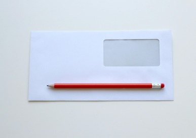 business envelope and pencil