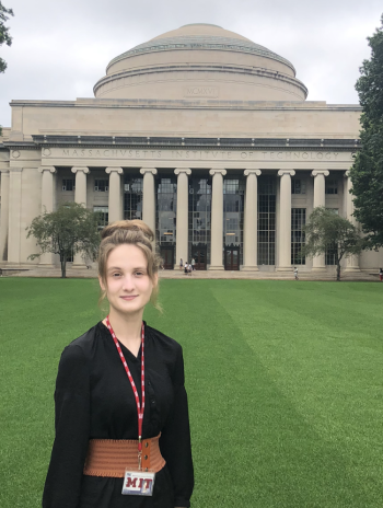 Angelina Rogatch standing in front of a domed building with pillars. 