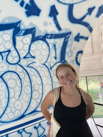 Claire Ford in front of a mural.