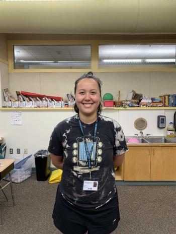 Emma Samstein standing in a classroom