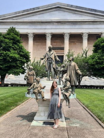 Julia Browning in front of a building. 