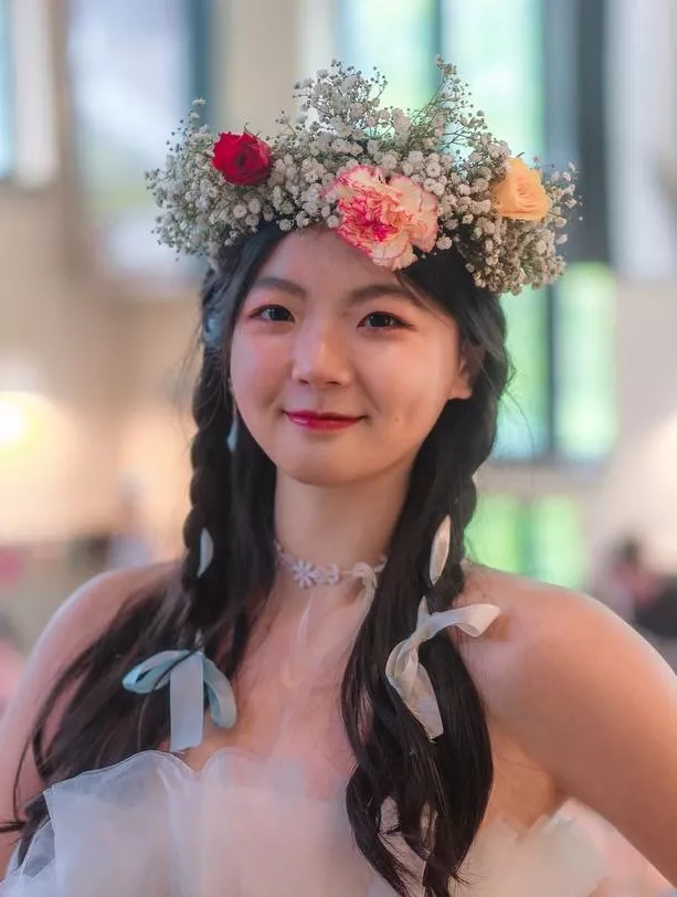 Yuan Tan in a flower crown. 