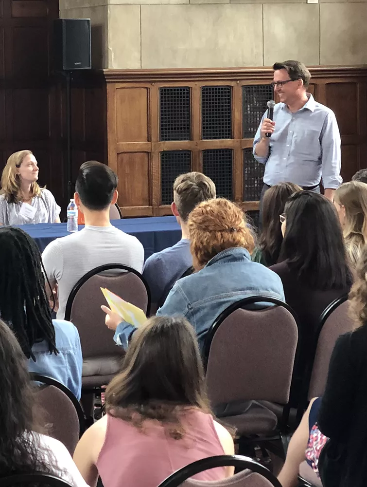 Program Director Glenn Cummings leads a panel of previous students at the Postbac orientation.