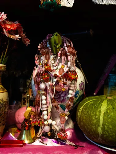 Image of vase, beads, and gourd