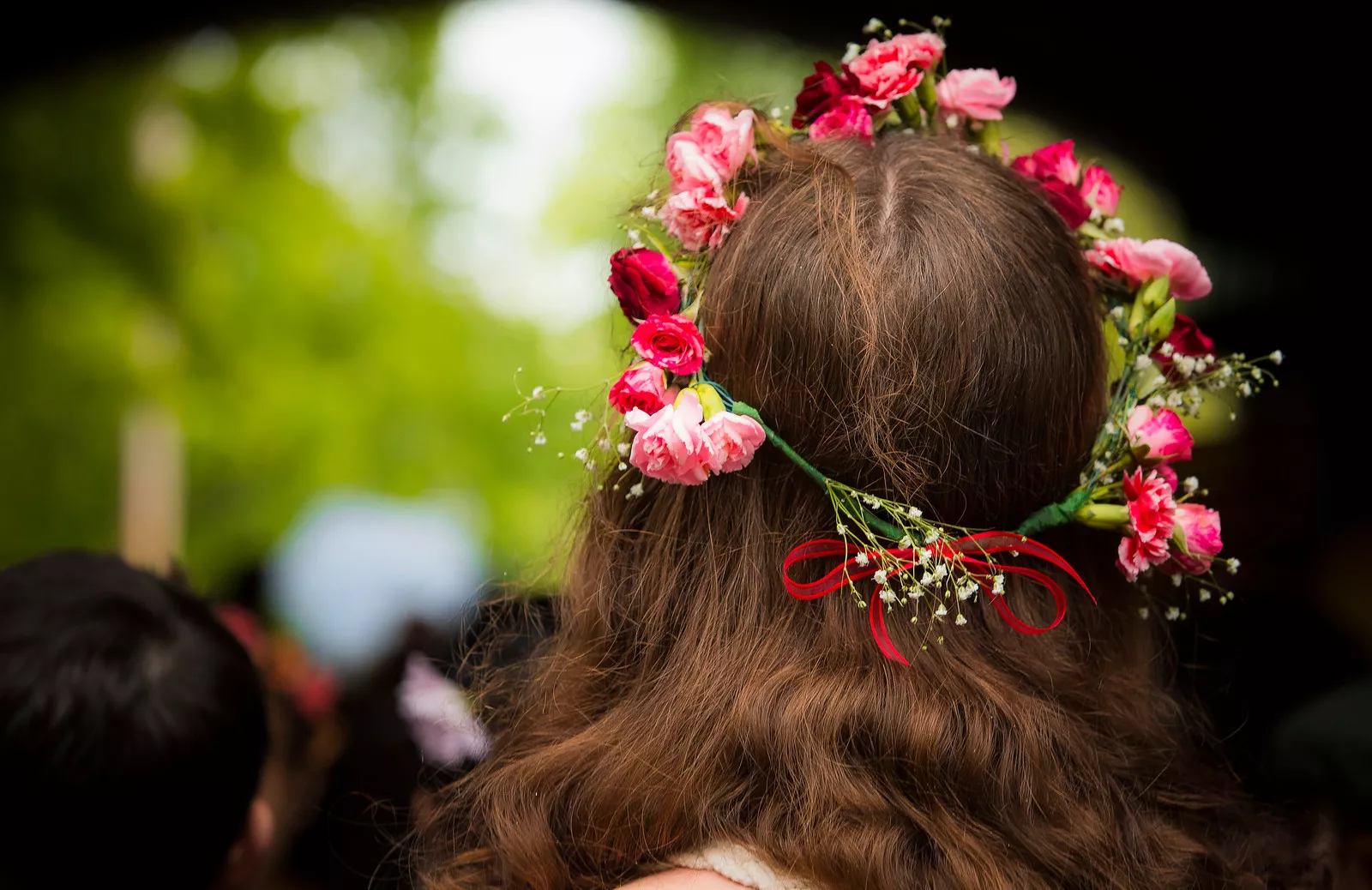 Student wearing a flower crown on May Day