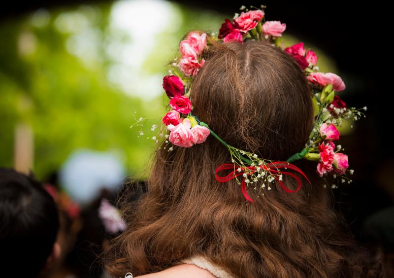 Student wearing a flower crown on May Day