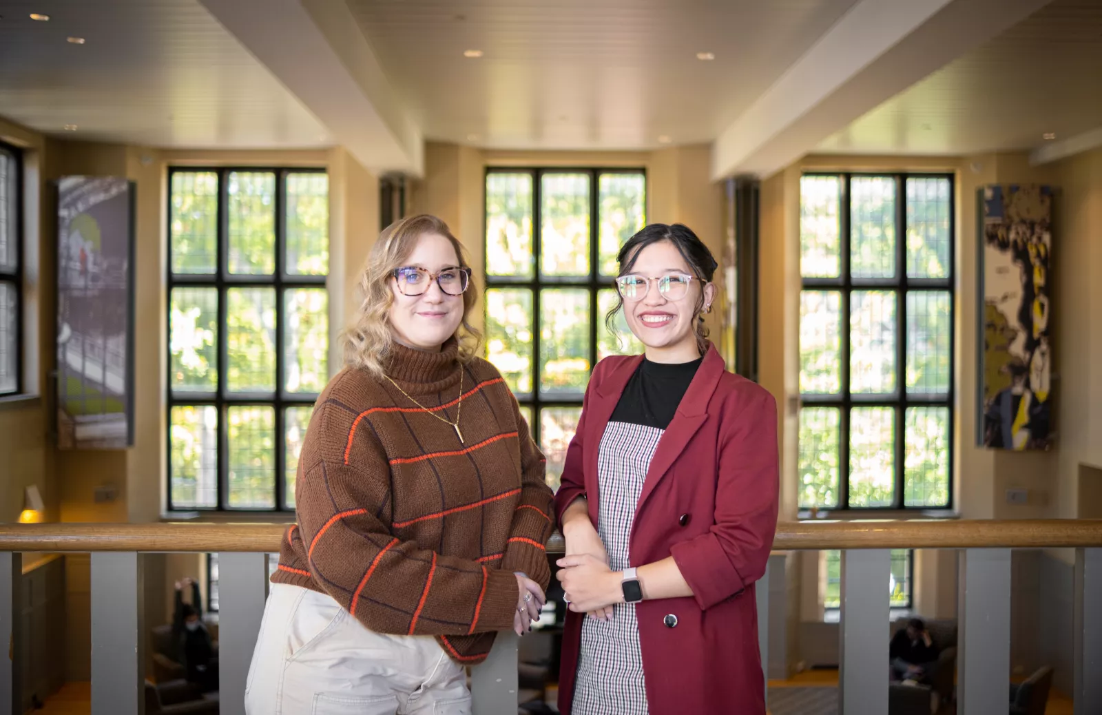 Left is Missy MacPherson and right is Mia Harvey posing in the Campus Center