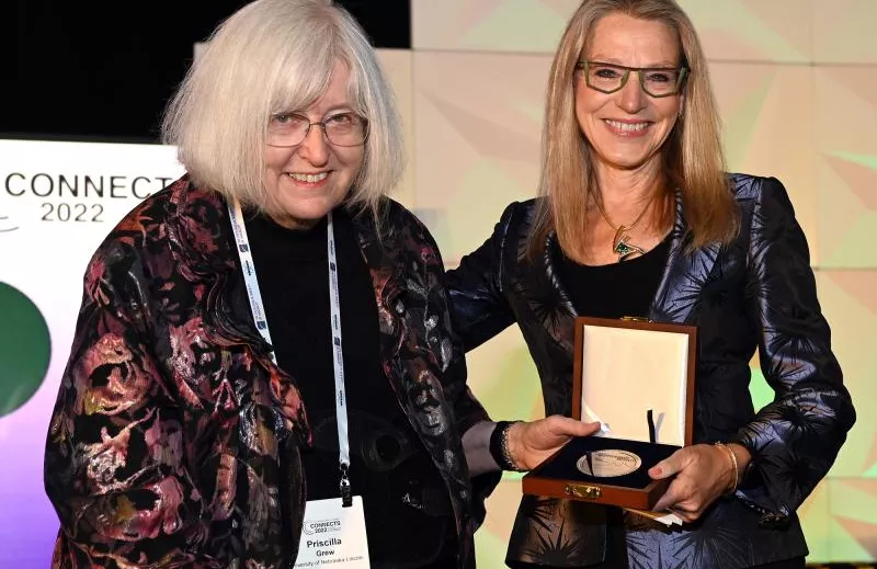 GSA President Barbara Dutrow awards the GSA President’s Medal to Priscilla Grew '62. Photo credit: Geological Society of America, photo by Bill Cronin.