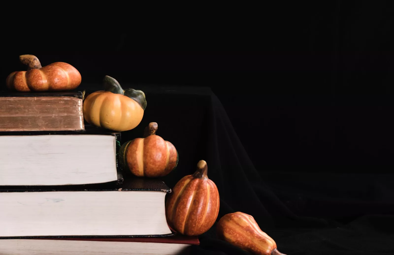 pumpkins-books-black-background