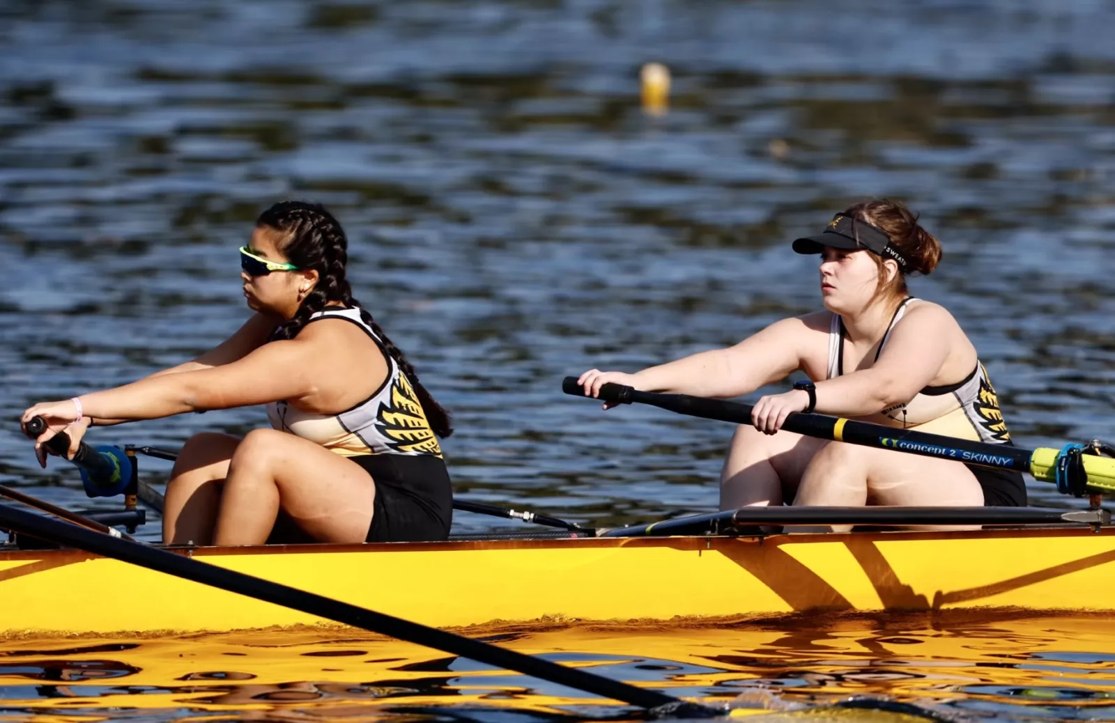 two students rowing