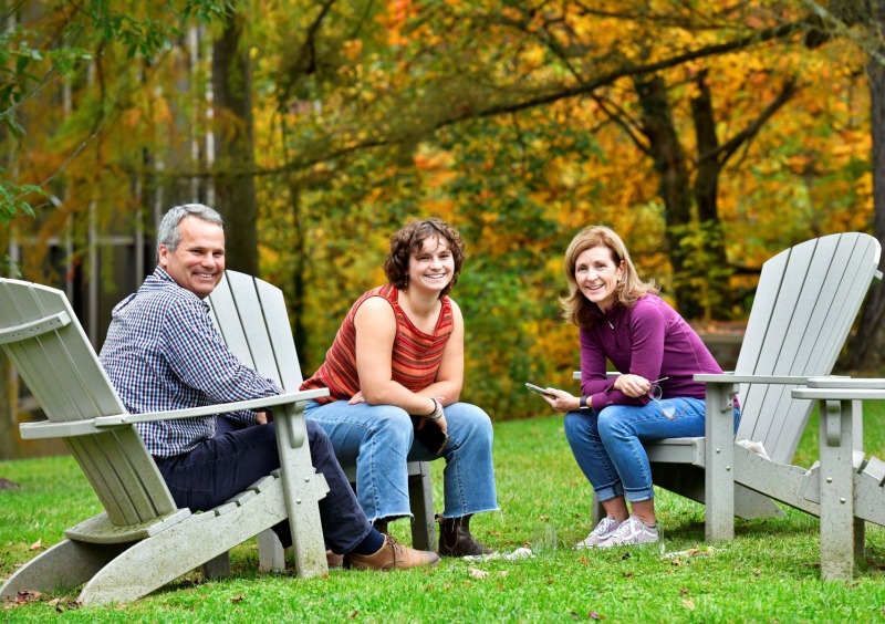 BMC family sitting in chairs outside