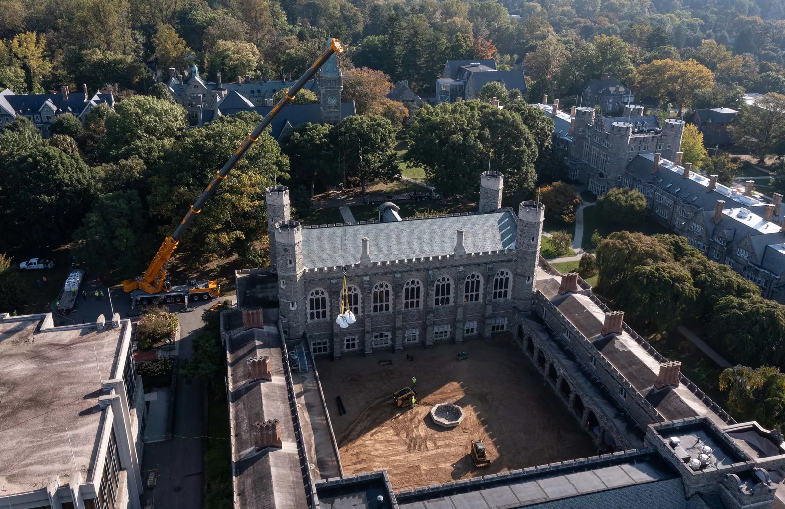 Crane moving materials into cloisters