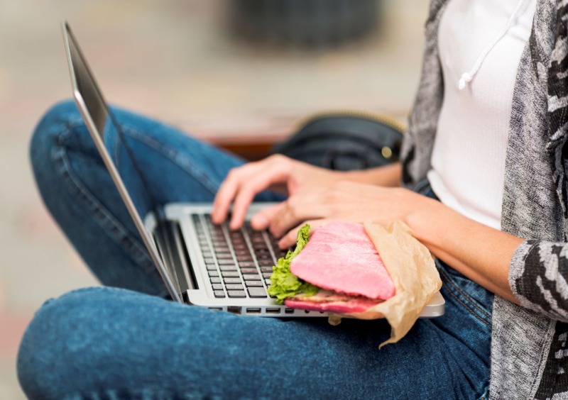 Laptop and lunch stock