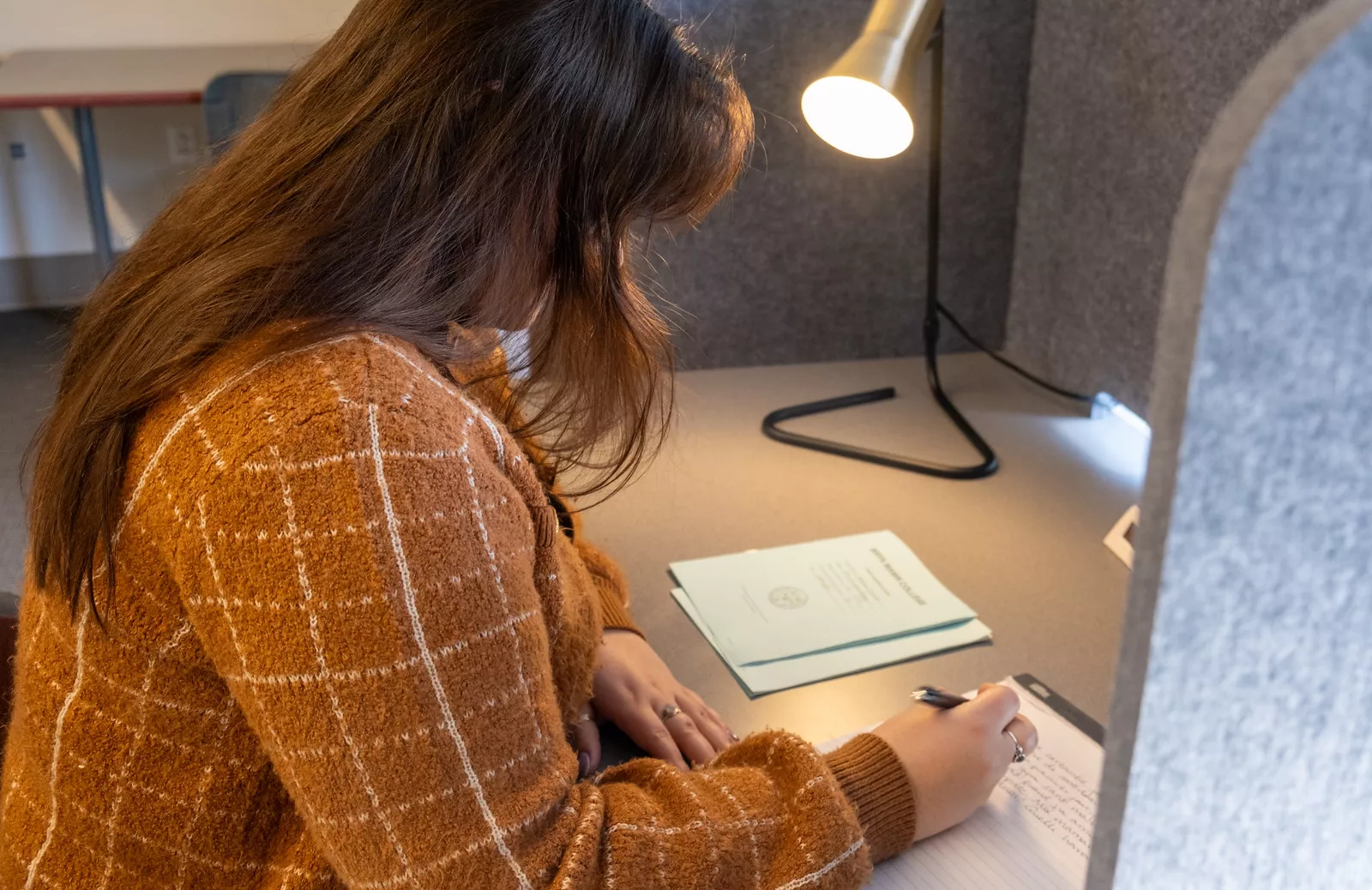 student sitting at a desk in the testing center