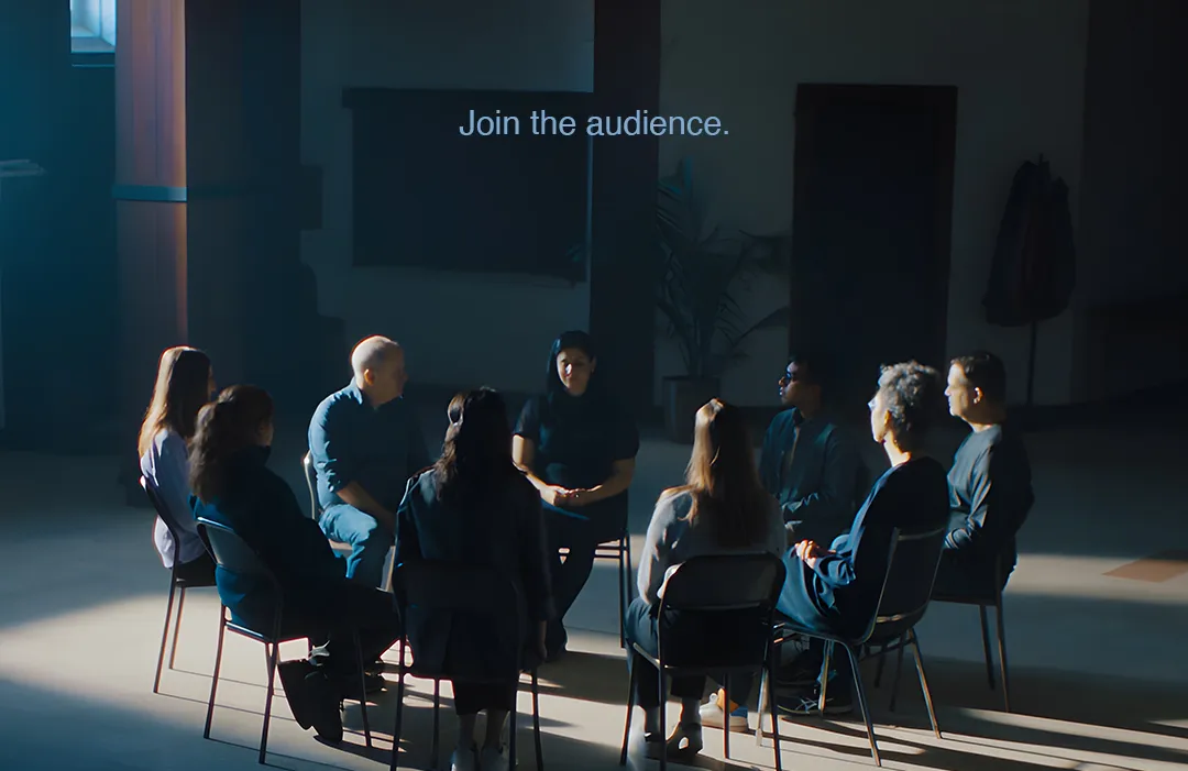 Film poster for We Are the Audience. A group of people sit in a chairs arranged in a circle.