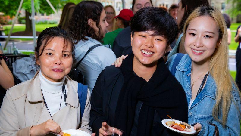 Photo of Felix Qiang, mother, and friend at Reunion.