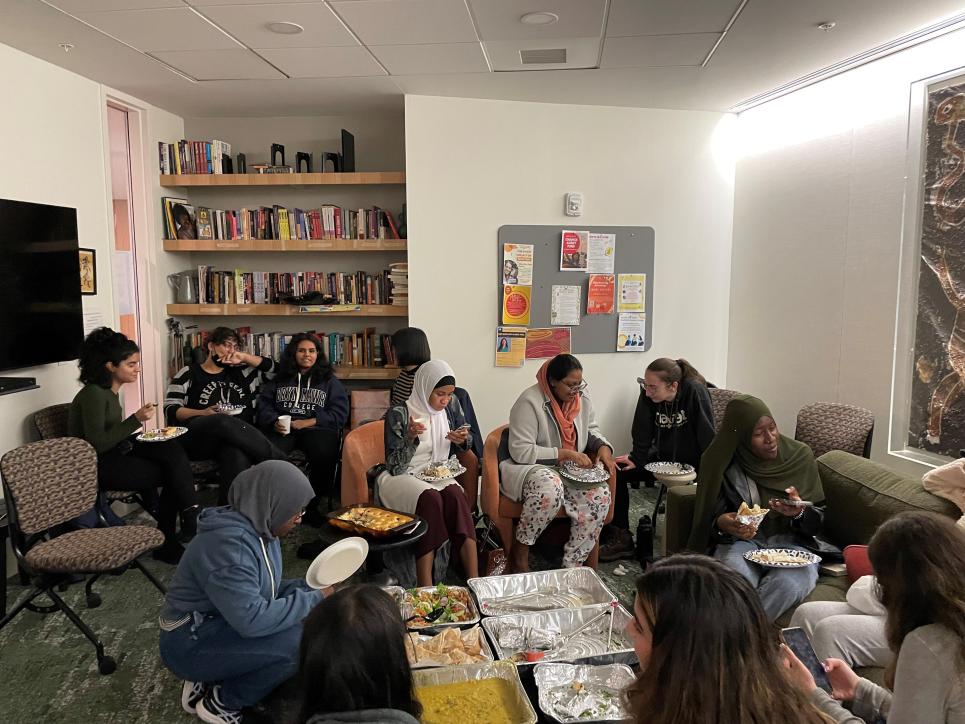 Students enjoying halal food in the Multicultural living room at The Well