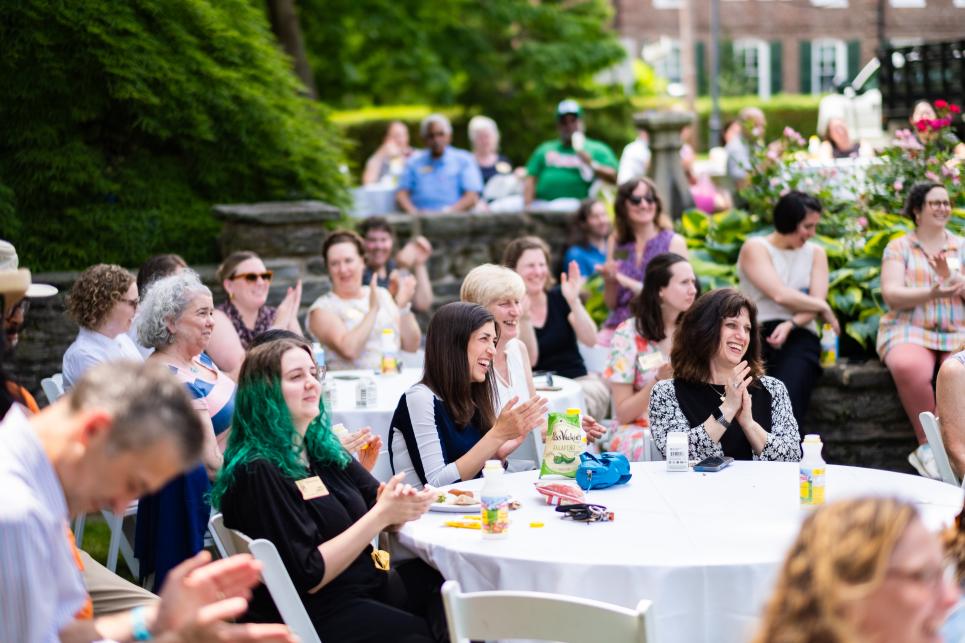 Staff members cheer on recognized colleagues