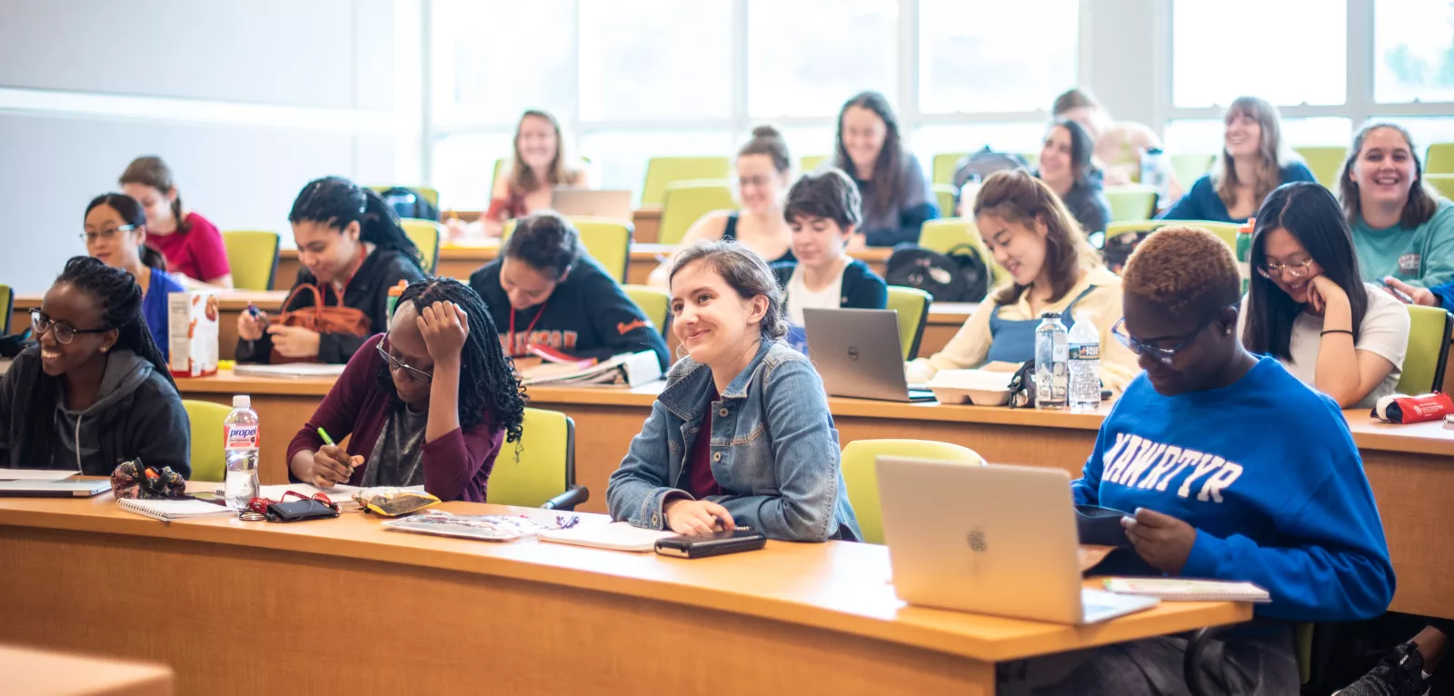 students in classroom taking notes