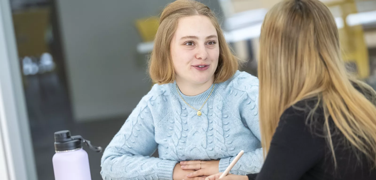 Two students sitting at table 