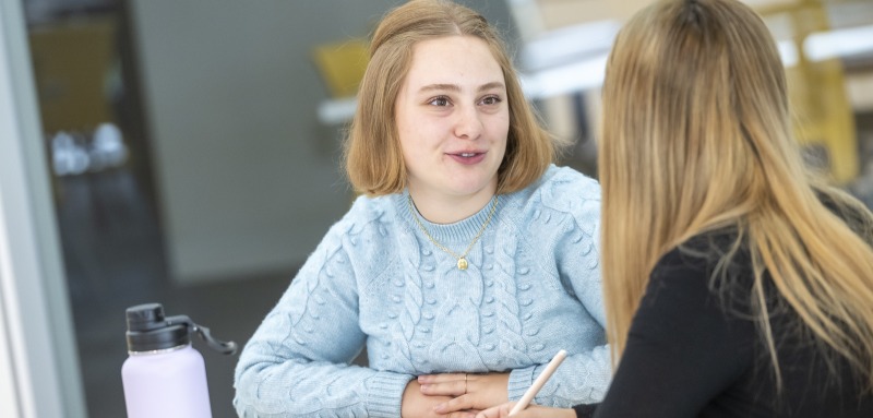 Two students sitting at table 