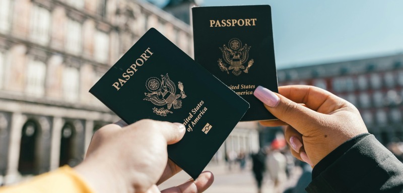 Global Engagement - Two people holding passports 