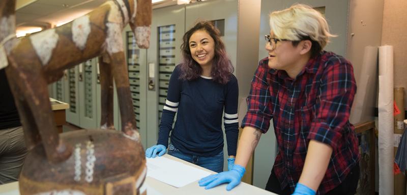 Students looking at sculpture in Collections Lab