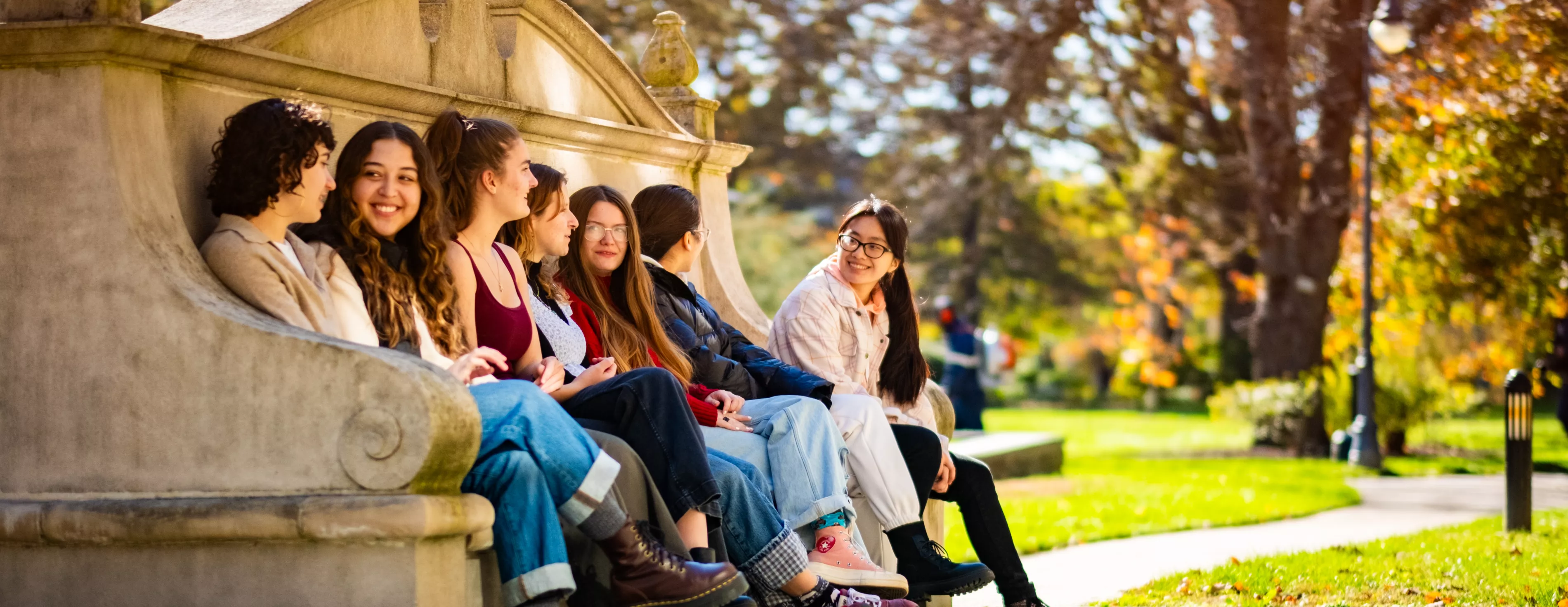 students-sitting-moon-bench