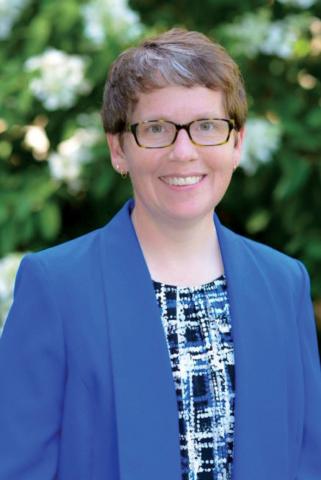 Portrait of Becky Ross in a blue blazer