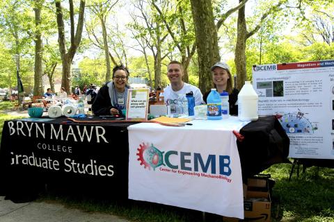 Students, including Andy Clark, sitting at a GSAS table for an event