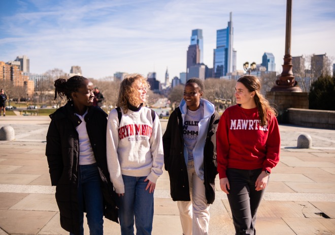 Four students walking up the "Rocky Steps" at the Philadelphia Museum of Art