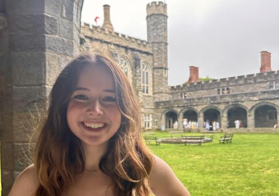 Camille standing in the Cloisters