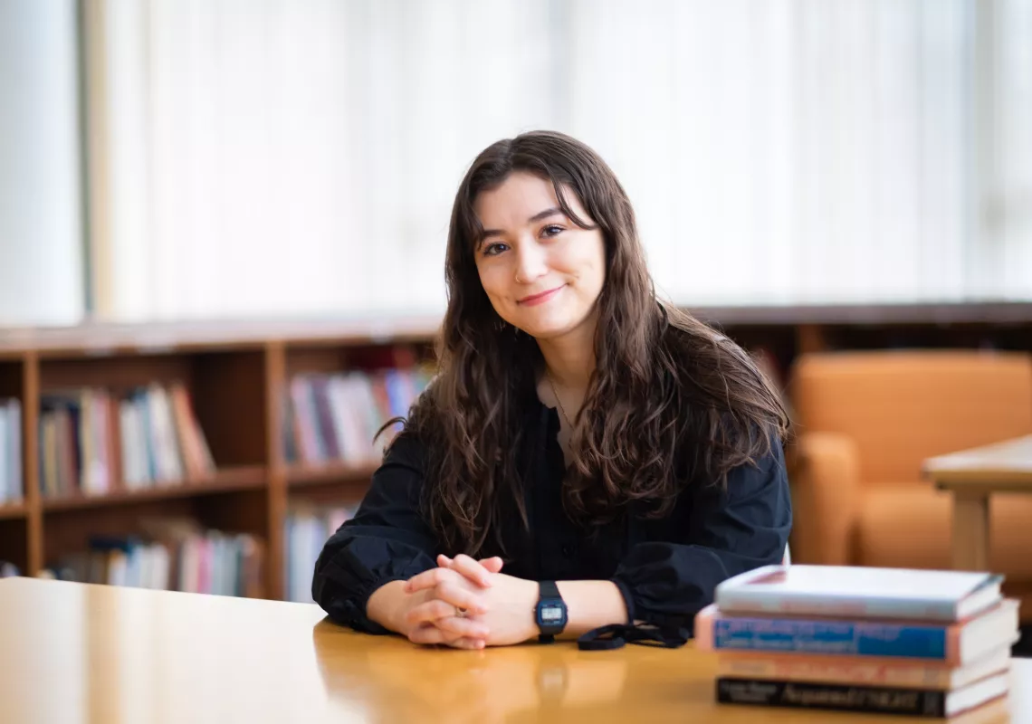 Zoe Kaufmann at a library desk