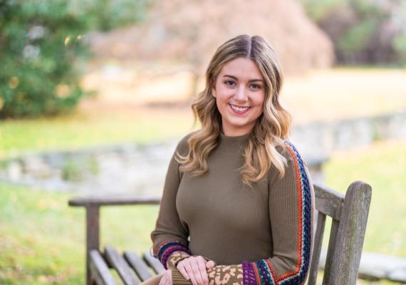 Regan Riehl sitting on a bench