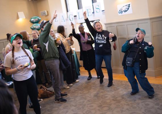 Angie Sheets doing Eagles cheer at Super Bowl Pep Rally in Campus Center