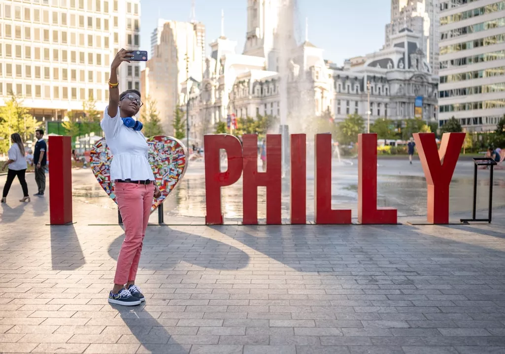 person taking selfie at Philadelphia's love park