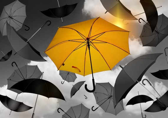 Collection of Grey Umbrellas, featuring a yellow umbrella