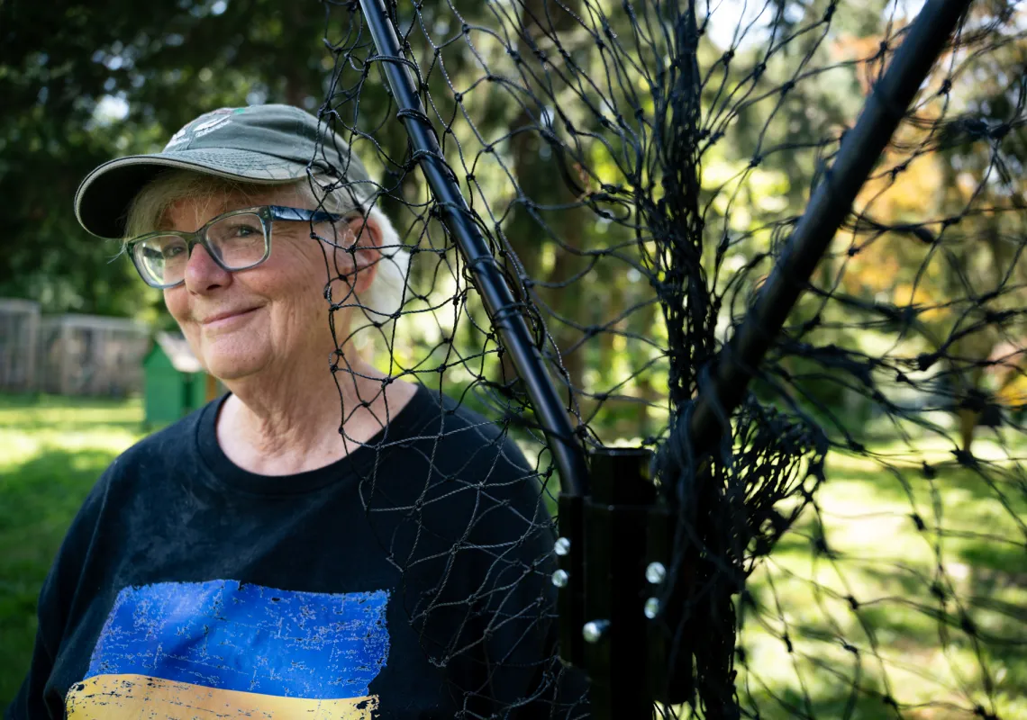 Barbara Miller ’75 poses with her favorite net