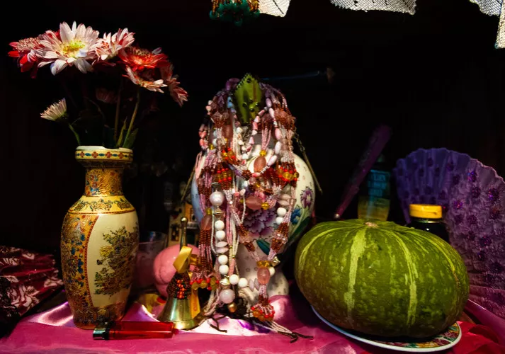 Image of vase, beads, and gourd