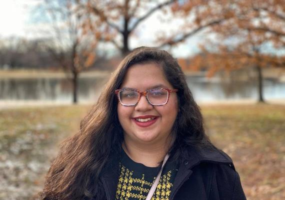 Mayisha Rahman in front of a lake.